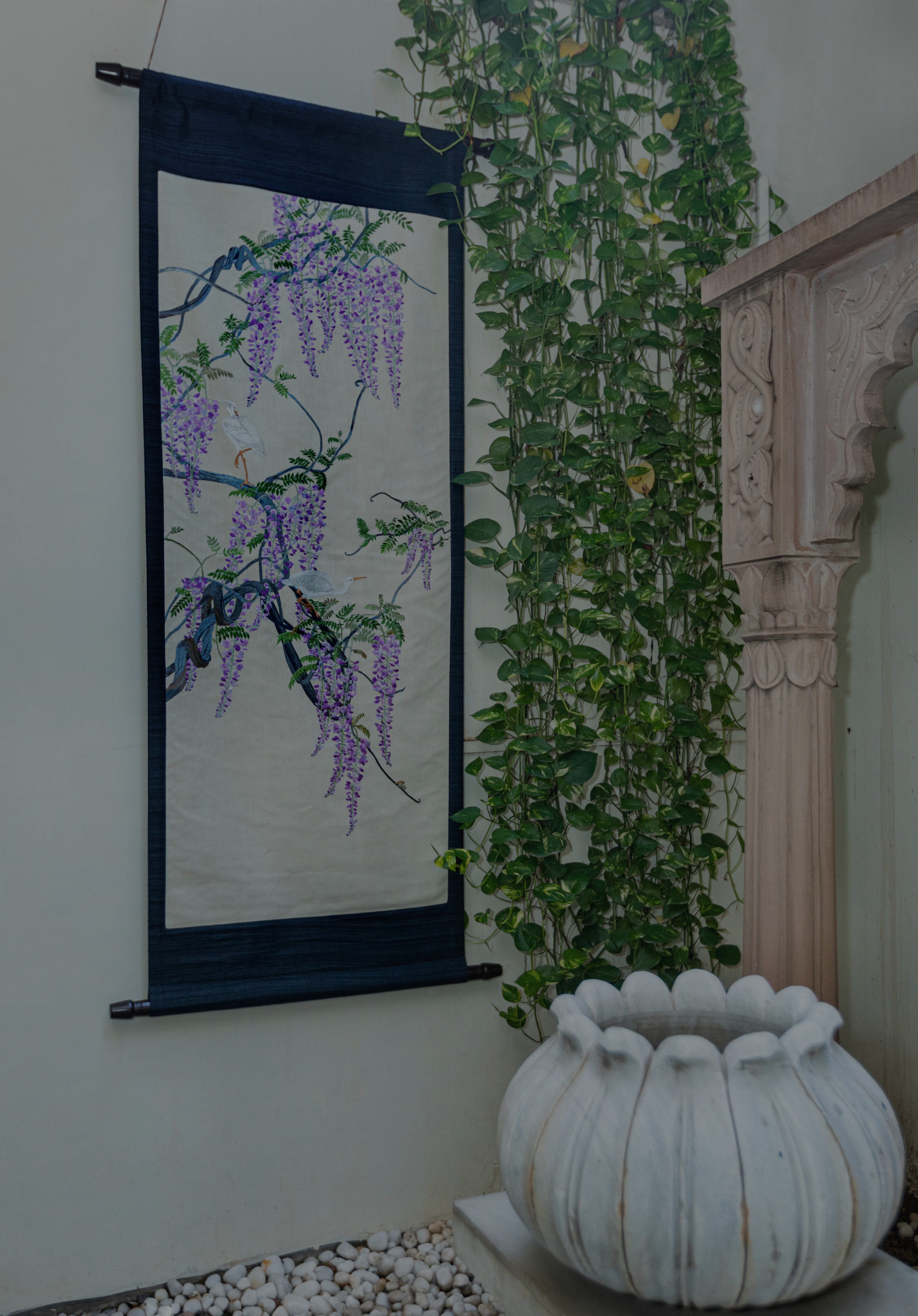 Inspired by an 18th century Meiji era embroidery tapestry of white egrets perched on climbing wisteria wines.

The fine needle work is rendered in a palette of pastel and earth tones in soft contrast to the grey brown of the tree bark.